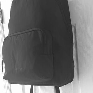 Calvin Klein Black Backpack with Curved Top and Spacious Design